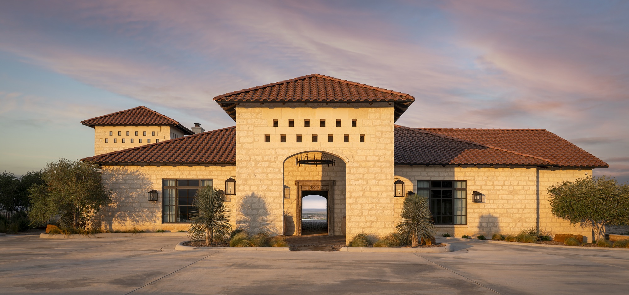 Limestone hacienda at Indianhead Ranch at sunset